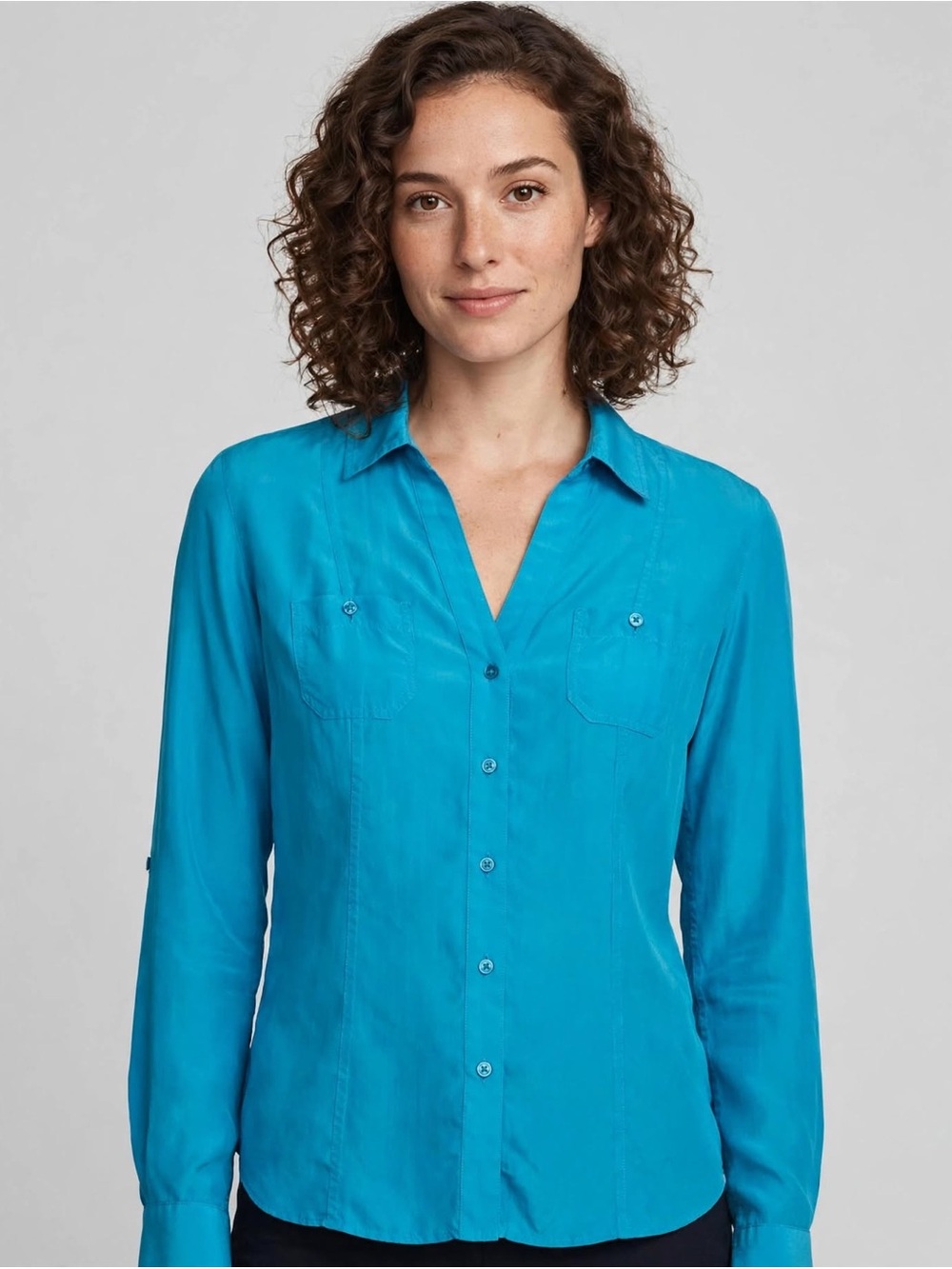 Tommy Bahama 100% silk V-Neck into button front, w/2 flat chest pockets.